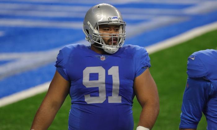 Penisini warms up before Week 12 game against the Houston Texans.